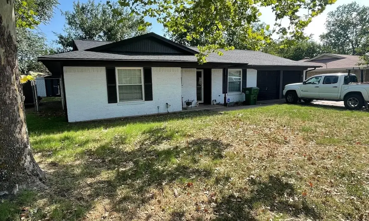 Professional roofing crew working on a residential roof in Groveport